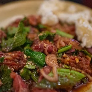 a plate of meat and vegetables