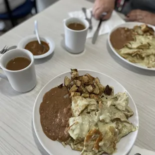 Chilaquiles poblanos gratinados ( melted white cheese) w shredded chicken.