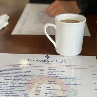 a cup of coffee on a table