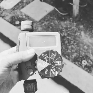 a hand holding a water meter