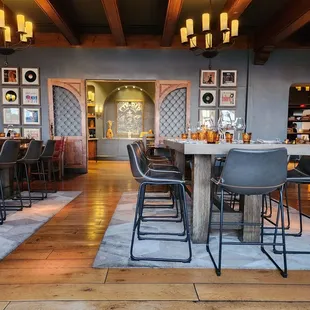 a dining area with tables and chairs