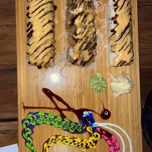 a wooden cutting board with food on it