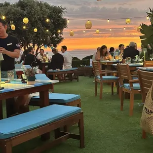 a group of people sitting at tables