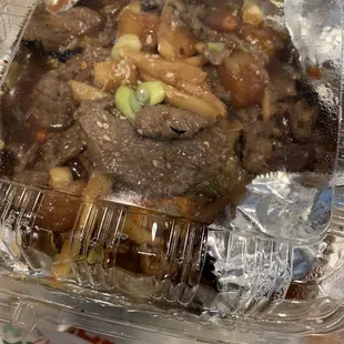 beef and vegetables in a plastic container