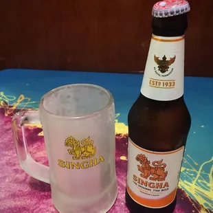 a beer and a glass on a table