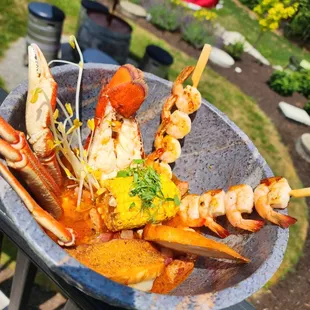 a plate of seafood skewers
