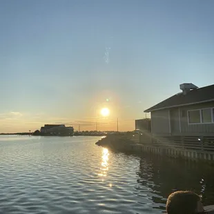 Outdoor deck with bar for waiting for a table.