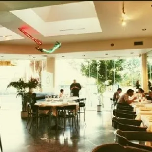 a dining room with tables and chairs