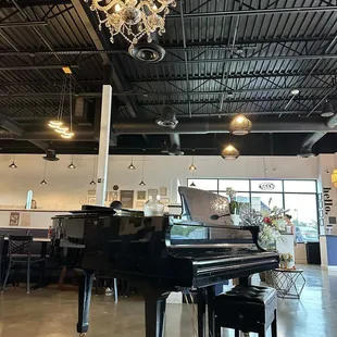 Dining room with Baby Grand piano and lighting.