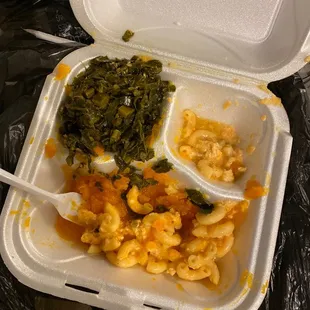 a take out container with macaroni and cheese