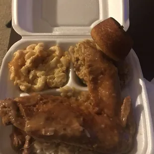 Talk Of The Town turkey wing dinner.Mac and cheese with dressing and a turkey wing on rice with a cornbread muffin.