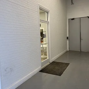 an empty room with a door open
