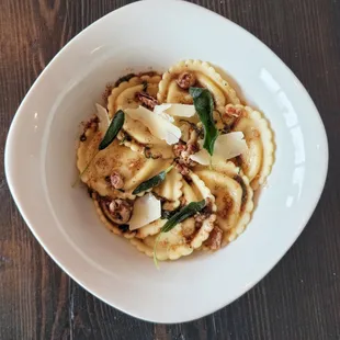 Japanese Pumpkin Ravioli - Japanese pumpkin, sweet potato, mascarpone, brown butter sage sauce, and candied pecans