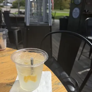 a glass of lemonade on a table