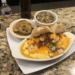 Shrimp and grits, veggies, and wild rice.