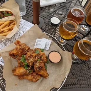 a table full of beer and food