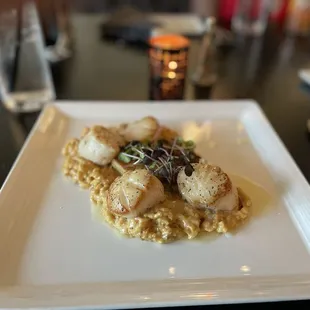 Scallops over crawfish risotto