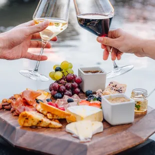 two people toasting with wine
