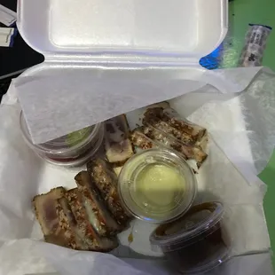 a chicken sandwich in a styrofoam container