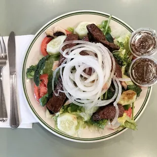 This diner is full service and has many amazing dishes including the very affordable steak salad with house dressing.