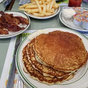 Hot cakes, bacon and friend's crinkle fries