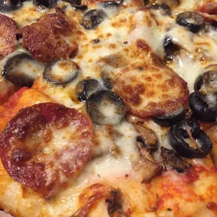 Delicious pepperoni, black olive, and mushroom pizza! So dangerous living one road away from Tally-Ho!