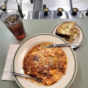 Lasagna with cheesy bread and fresh made ice tea.