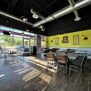 a dining area with tables and chairs