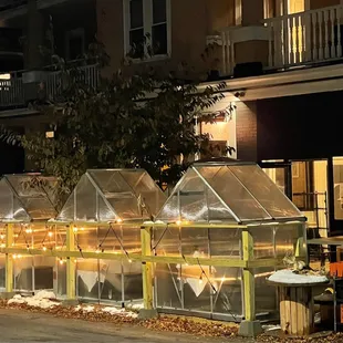 4 green houses seat 2 people each for outdoor dining all winter!