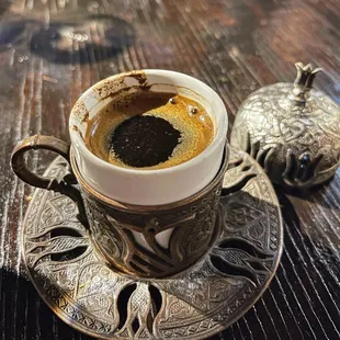 a cup of coffee on a saucer