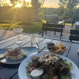 Salmon and Brussels sprouts salad and side of fries