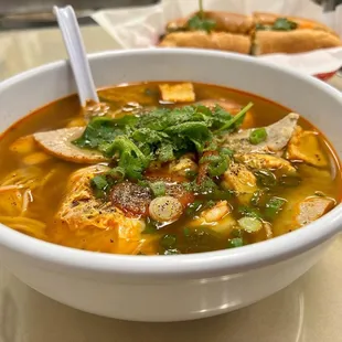 a bowl of soup and a sandwich