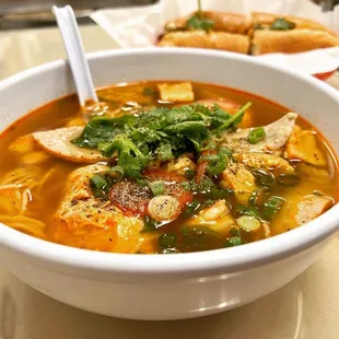 a bowl of soup and a sandwich