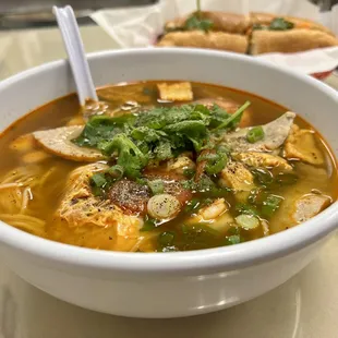 a bowl of soup and a sandwich