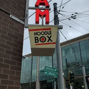 a sign for tam noodle box