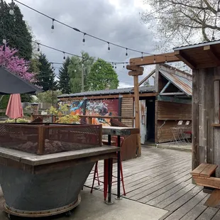 a patio area with tables and umbrellas
