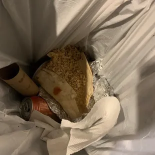 Disgusting chicken burrito that went right into the trash!
