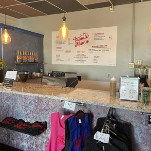 t - shirts on display at the counter