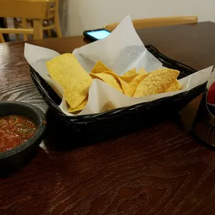 a bowl of chips and a can of pepsi