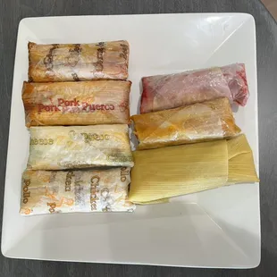 Our tamales are wrapped in labeled paper.