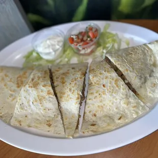 Meat Quesadilla: Any choice of meat with cheese, onion, cilantro, tomato and sour cream.