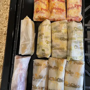 The order, 3 chicken tamales, 3 Pork Tamales, 3 cheese tamales, 1 Strawberry Tamale, 1 Pineapple Tamale