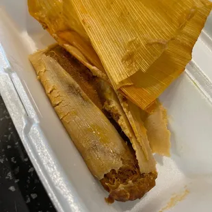 tamales in a styrofoam container