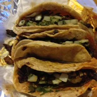 Trio of al pastor tacos, $1.60 each