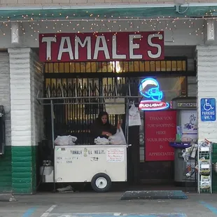 a man selling food from a cart