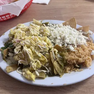 Chilaquiles Verdes with queso fresco &amp; crema Centro-Americana we brought since they don&apos;t use them here.