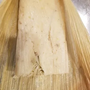 Corn husk wrapped chicken tamale, I cut part of it already. Very good - recommend! 7/19/2020