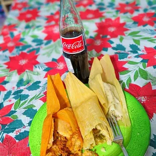 a bottle of coke and a plate of food