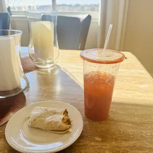 Eggs, Chorizo, cheese, and green chili burrito with a Michelada!