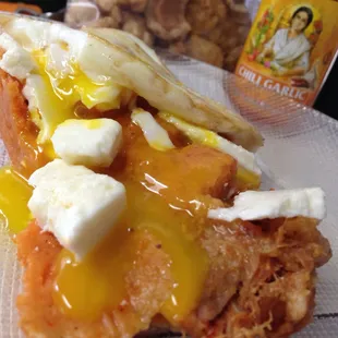 Tamales Moreno tamale with Queso Frecso, Egg Over Medium, hot sauce and Chicharones. My creation with their tamale.
